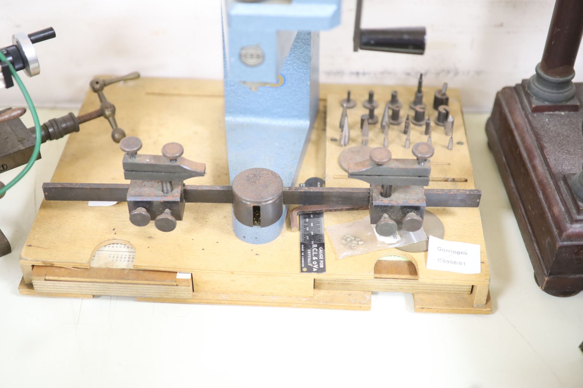 Watch & Clockmakers tools - an Elma bushing tool, the base with two integral trays of bushes, 36.5cm wide